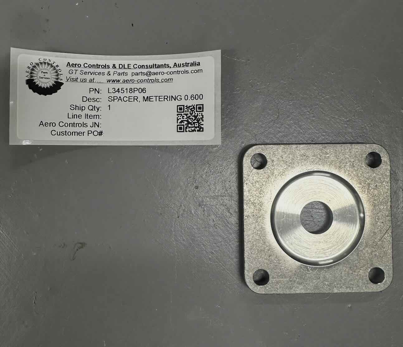 L34518P06 SPACER, METERING, 0.600 ORIFICE DIAMETER
