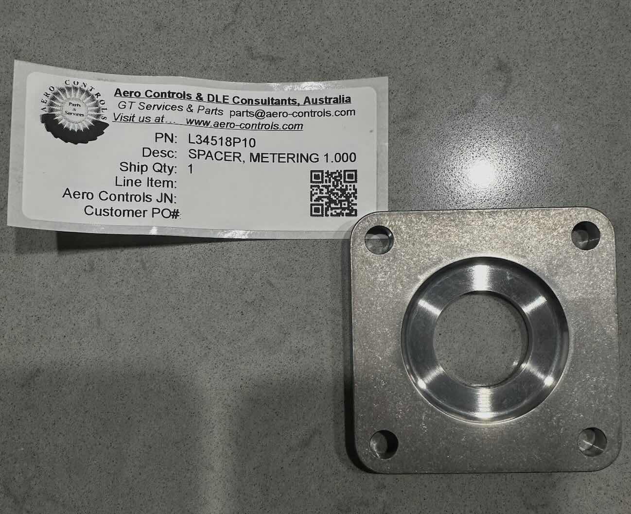 L34518P10 SPACER, METERING, 1.000 ORIFICE DIAMETER